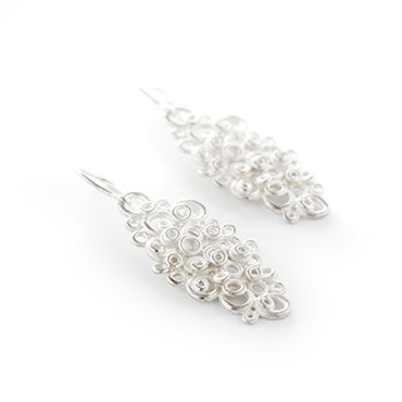 Large, long earrings with lace motif