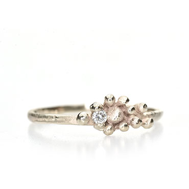 Engagement ring with fine details and diamond