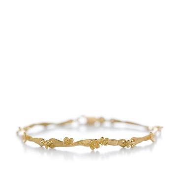 Golden bracelet with floral details