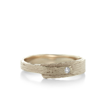 narrow engagement ring with wood texture in gold