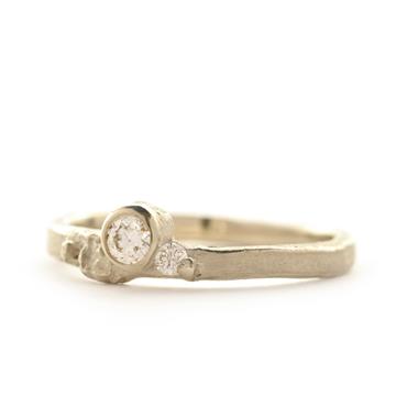 thin ring with structure and 2 diamonds
