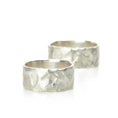 Wide wedding rings with wavy texture