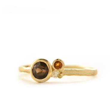Unique ring with brown (semi-) precious stones