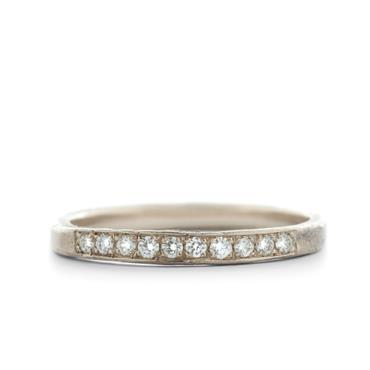 White gold ring with lined up diamonds