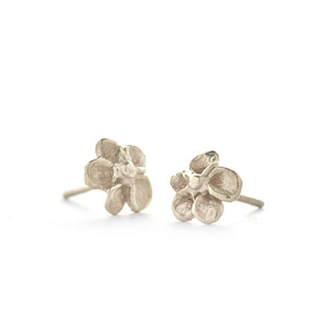 White golden ear studs flowers