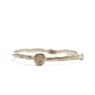 Ring with disc and stamped letter