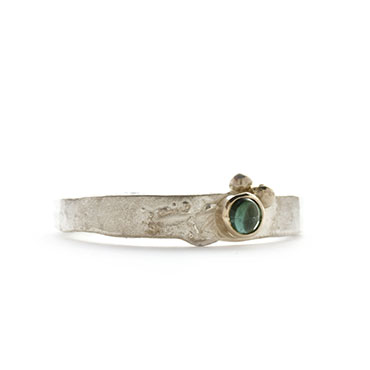 unique ring with colored stone in gold detail
