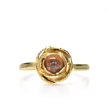 rose on golden ring with tourmaline