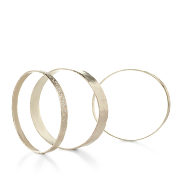 Gold bracelets with hammered structure