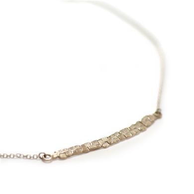 Raw gold intermediate piece between necklace