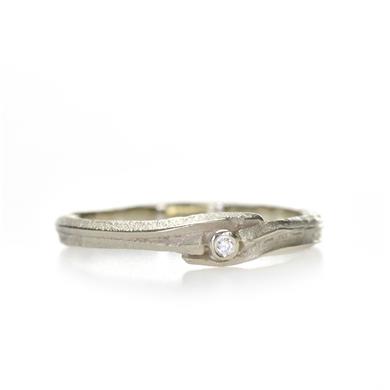 Narrow golden ring with diamond