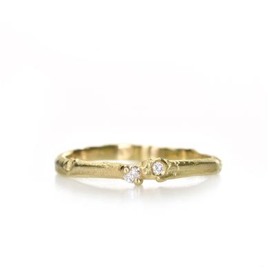 Narrow golden ring with diamonds