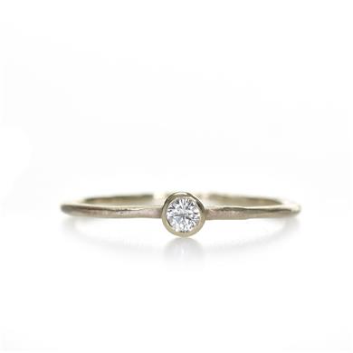 Narrow golden ring with diamond