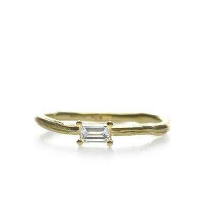 Narrow golden ring with diamond