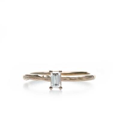 Narrow golden ring with diamond