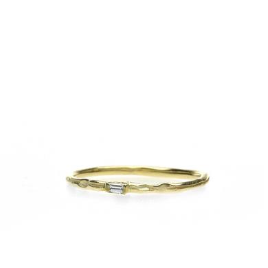 Narrow golden ring with diamond