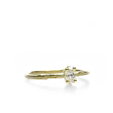 Narrow golden ring with diamond