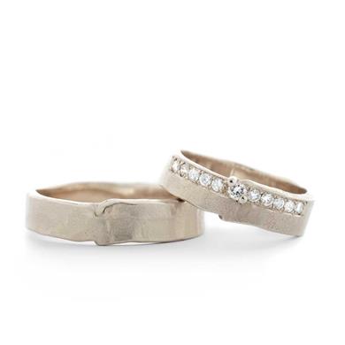 Wedding rings with a row of diamonds