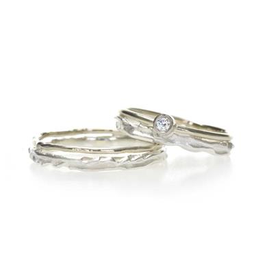 Thin serrated silver wedding rings with gold
