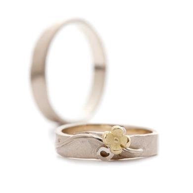 hammered wedding rings with flower detail