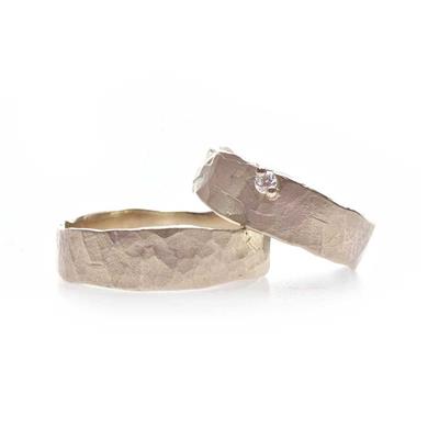 Golden wedding rings with hammered texture