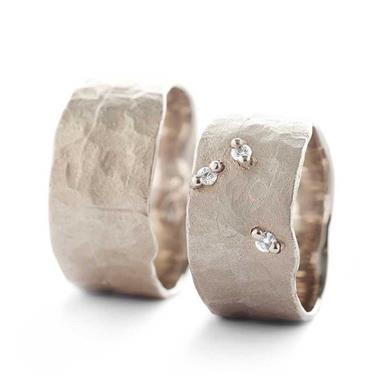 Wide hammered wedding rings in gold