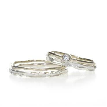 Thin serrated silver wedding rings with gold