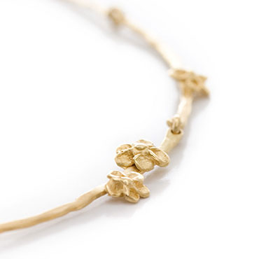 Gouden bloemetjes ketting - Wim Meeussen Antwerpen
