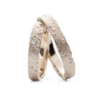 Narrow rough wedding rings in white gold